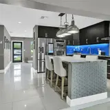 Kitchen with a central island and bar stools