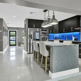 Kitchen with a central island and bar stools